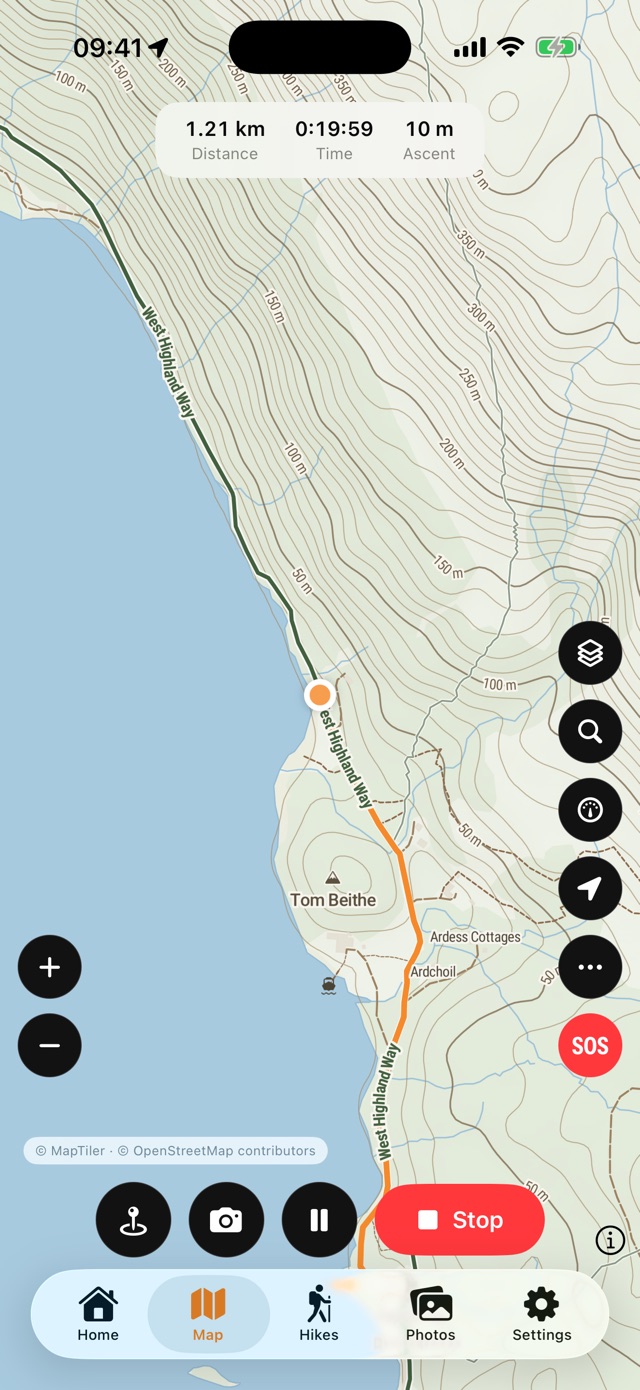 Recording a walk: 1.21 km, 19 minutes 58 seconds and 10 m of ascent shown over the topographic map, with Stop, pause, camera and waypoint buttons